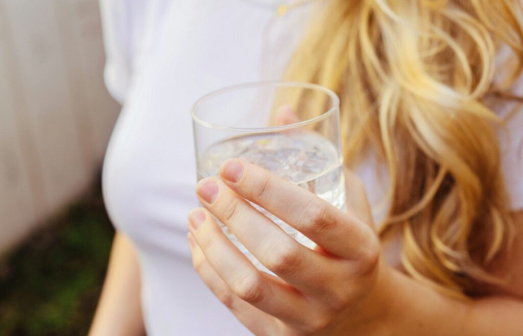 a woman holding a glass