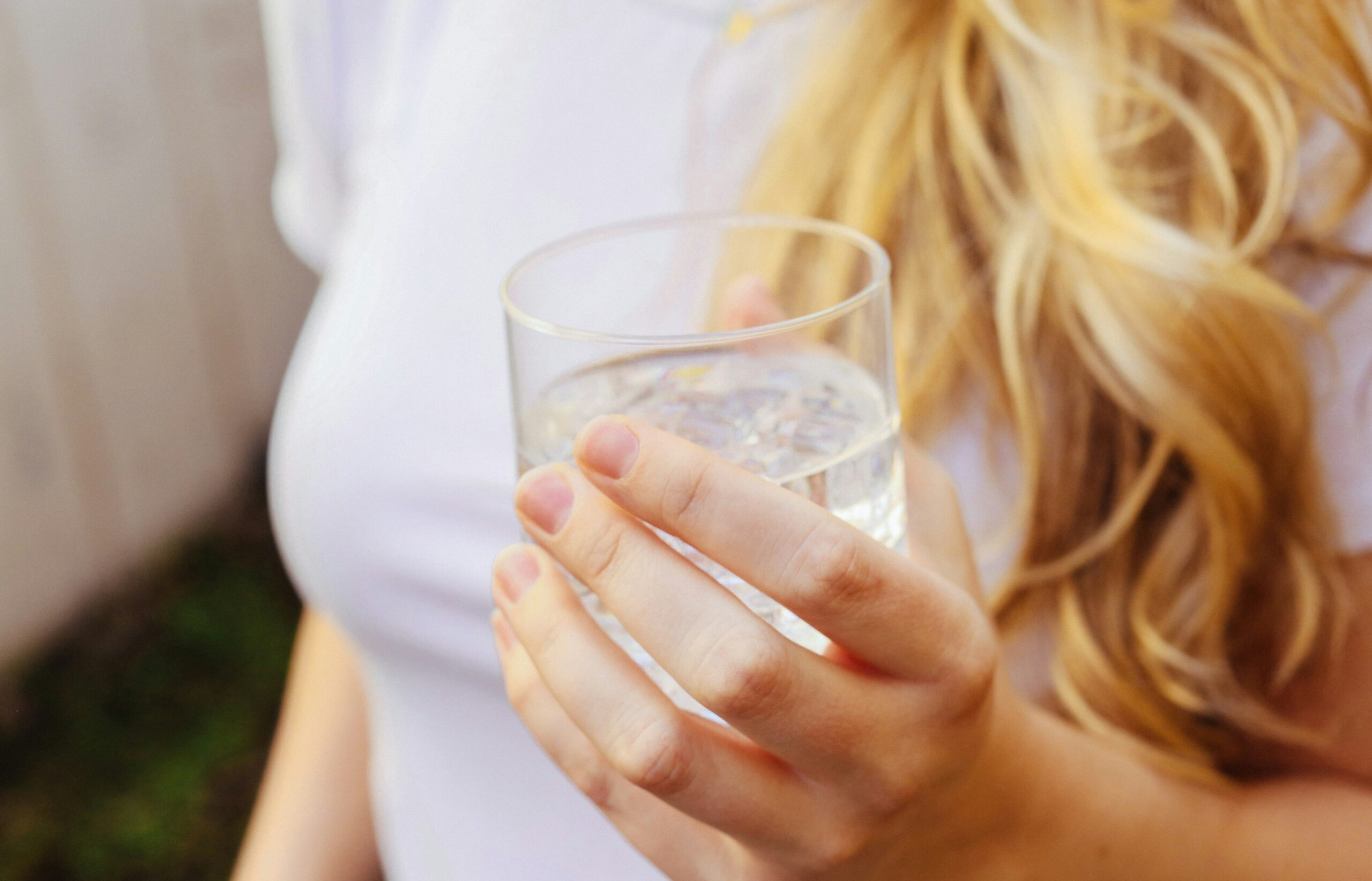 a woman holding a glass